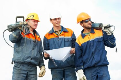 Construction workers with power tools