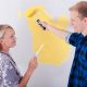 Couple painting wall together